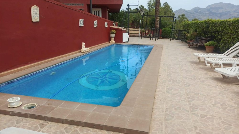spacious four-bedroom villa with pool in la nucía town bordering a green area 727324091