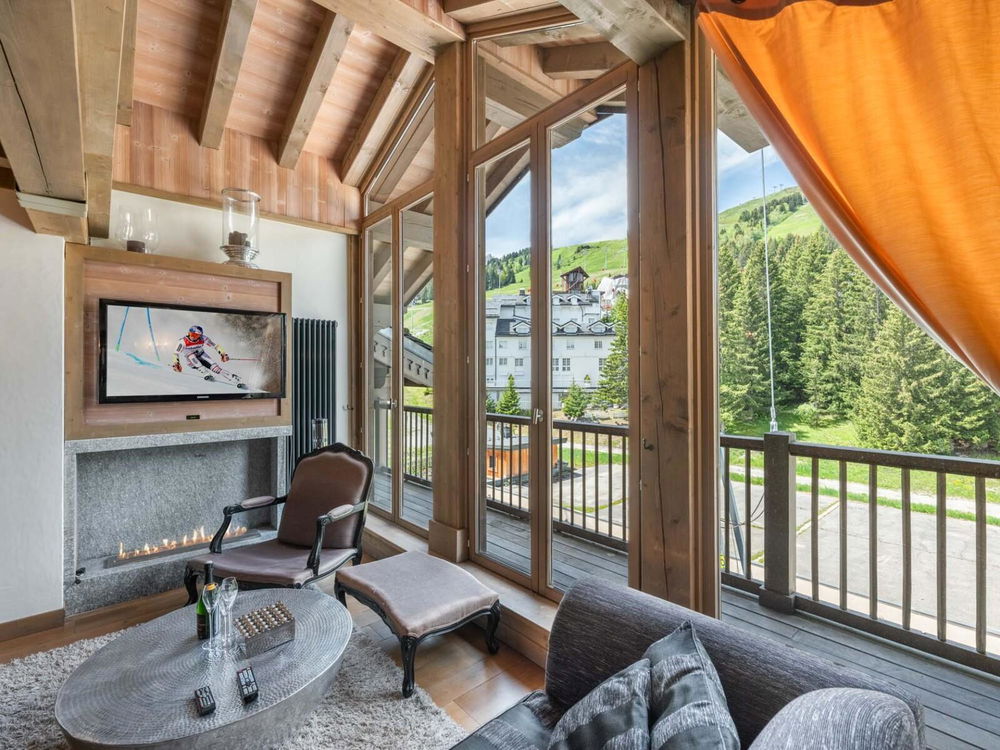Experience mountain excellence with this prestigious top-floor apartment in Courchevel 2497696208